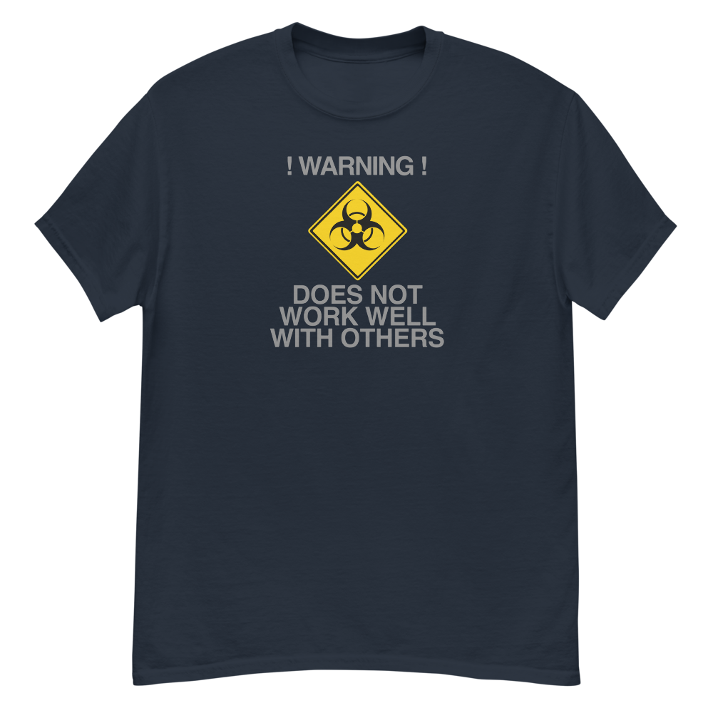 "!Warning! Does Not Work Well With Others" printed on a navy unisex classic tee laying on a flat surface