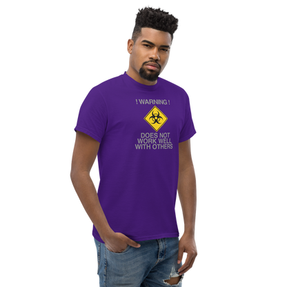 "!Warning! Does Not Work Well With Others" printed on a purple unisex classic tee worn by a male
