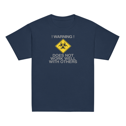 "!Warning! Does Not Work Well With Others" printed on a navy youth classic tee laying on a flat surface