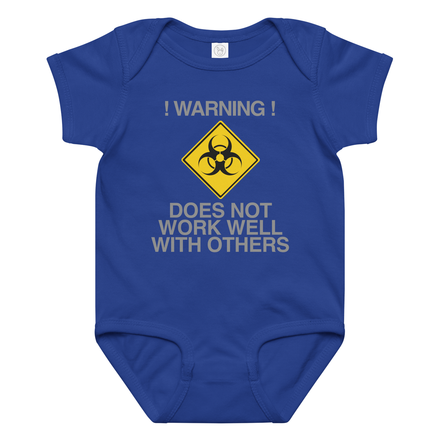 "!Warning! Does Not Work Well With Others" printed on a royal baby jersey bodysuit laying on a flat surface amongst other clothes