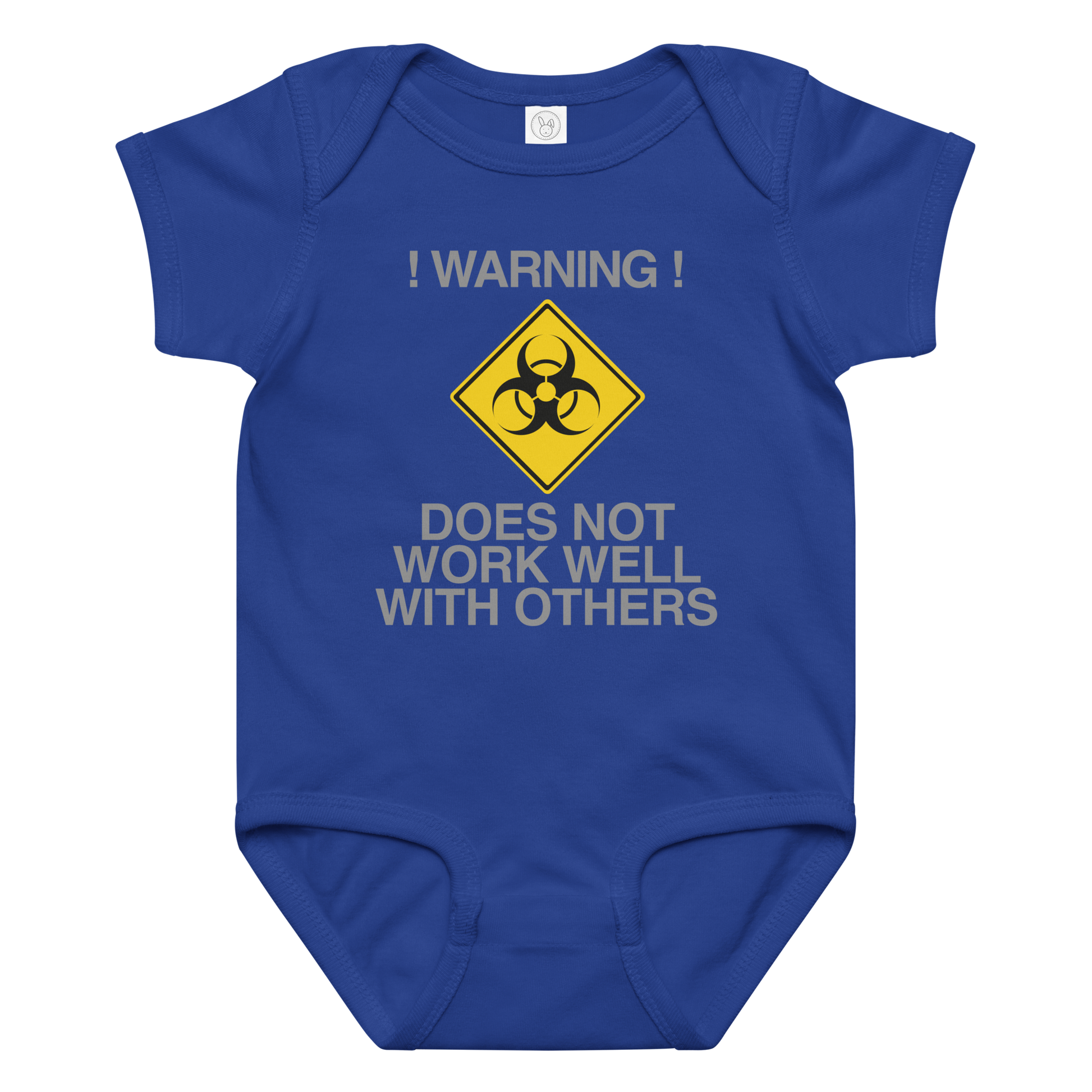 "!Warning! Does Not Work Well With Others" printed on a royal baby jersey bodysuit laying on a flat surface amongst other clothes