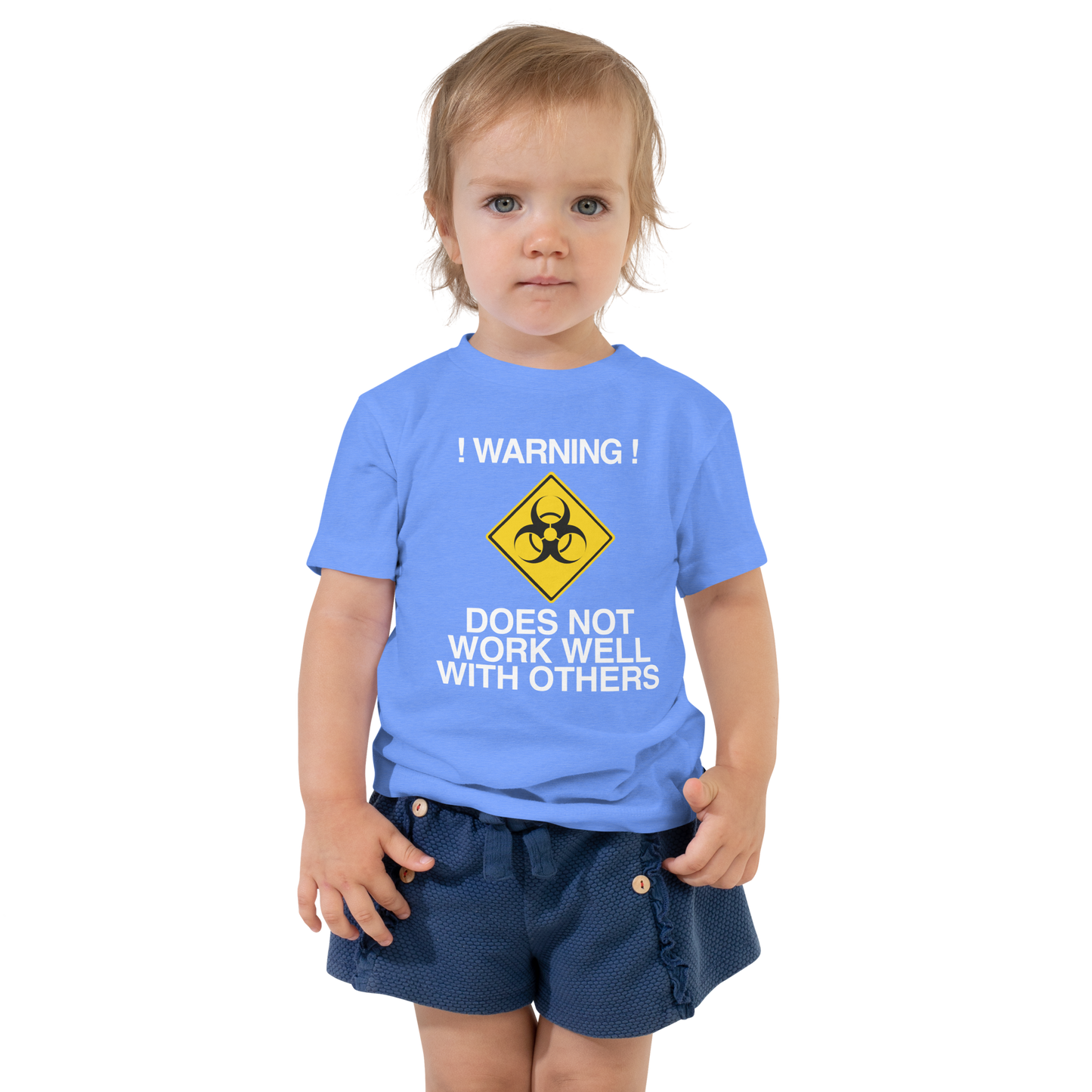 "!Warning! Does Not Work Well With Others" printed on a heather columbia blue toddler short sleeve tee worn by a female