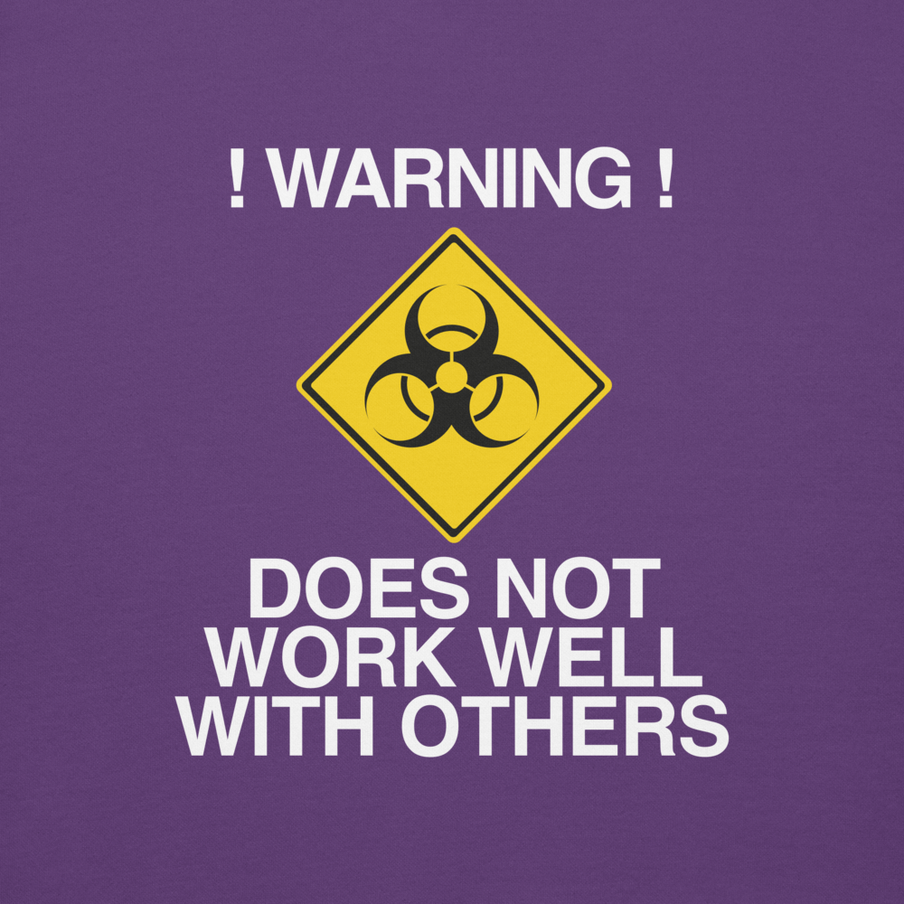 "!Warning! Does Not Work Well With Others" printed on a purple background