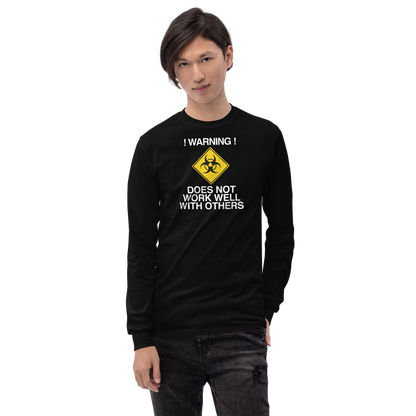 "!Warning! Does Not Work Well With Others" printed on a black men's long sleeve shirt worn by a male