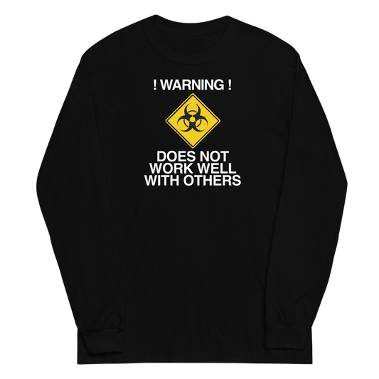 "!Warning! Does Not Work Well With Others" printed on a black men's long sleeve shirt laying on a flat surface