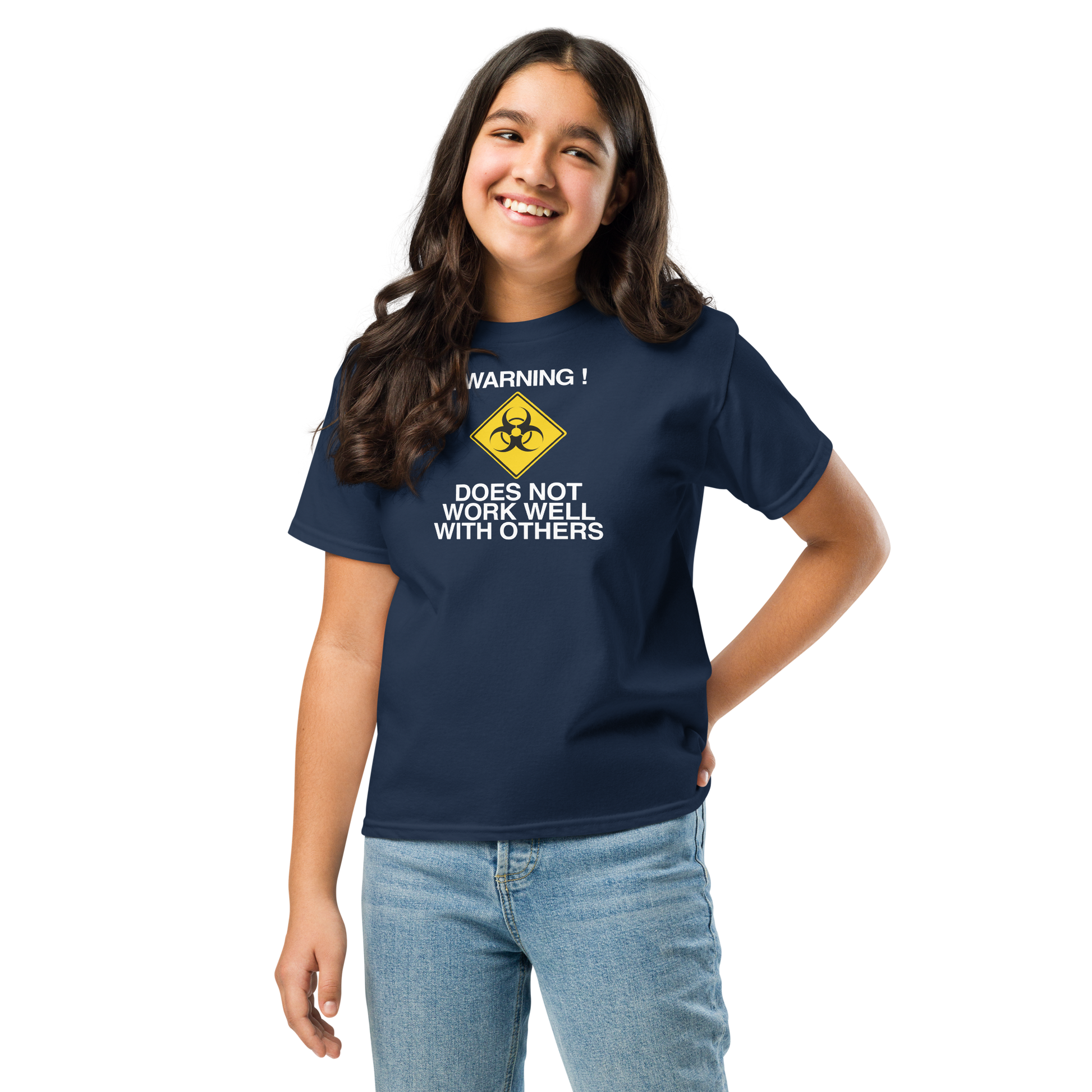 "!Warning! Does Not Work Well With Others" printed on a navy youth classic tee worn by a female