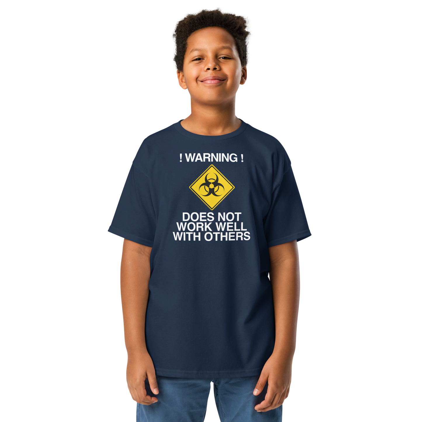 "!Warning! Does Not Work Well With Others" printed on a navy youth classic tee worn by a male