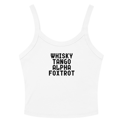 "Whisky Tango Alpha Foxtrot" printed on a solid white blend women's micro-rib tanktop laying on a flat surface amongst sunglasses and shorts