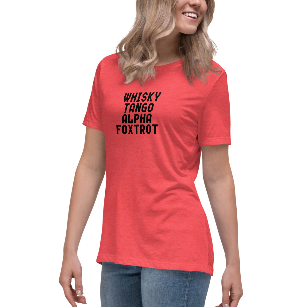 "Whisky Tango Alpha Foxtrot" printed on a heather red women's relaxed t-shirt worn by a female
