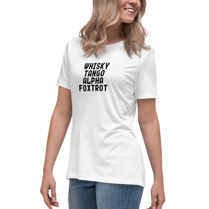 "Whisky Tango Alpha Foxtrot" printed on a white women's relaxed t-shirt worn by a female