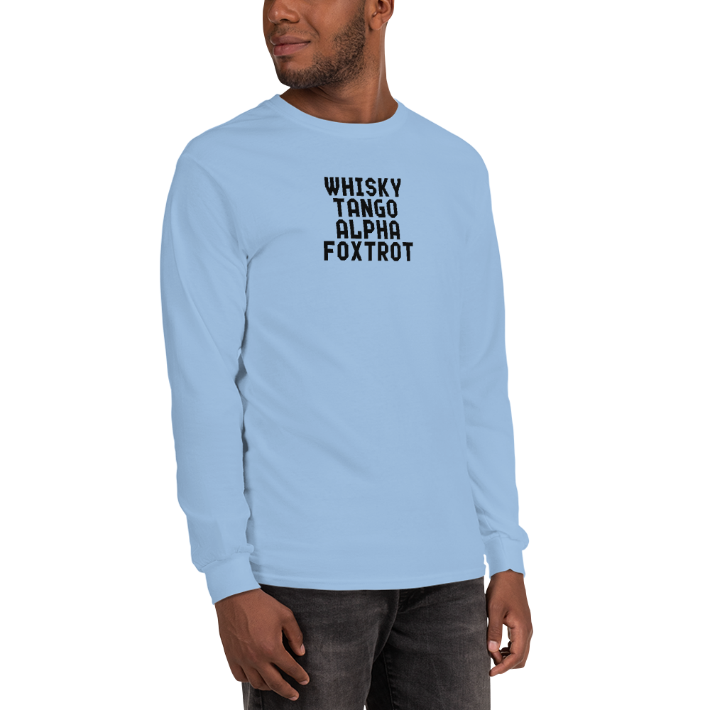 "Whisky Tango Alpha Foxtrot" printed on a light blue men's long sleeve shirt worn by a male