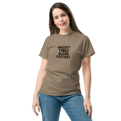 "Whisky Tango Alpha Foxtrot" printed on a brown savana unisex classic tee worn by a female