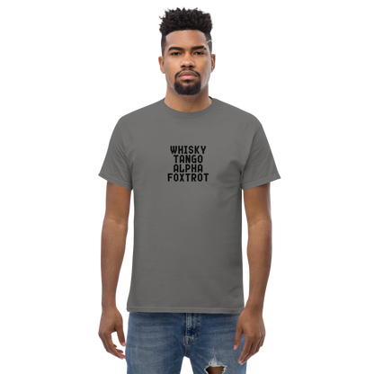 "Whisky Tango Alpha Foxtrot" printed on a charcoal unisex classic tee worn by a male
