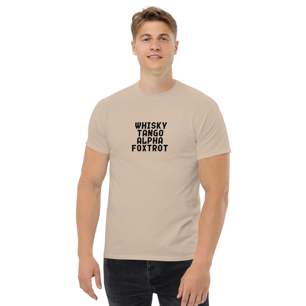 "Whisky Tango Alpha Foxtrot" printed on a sand unisex classic tee worn by a male