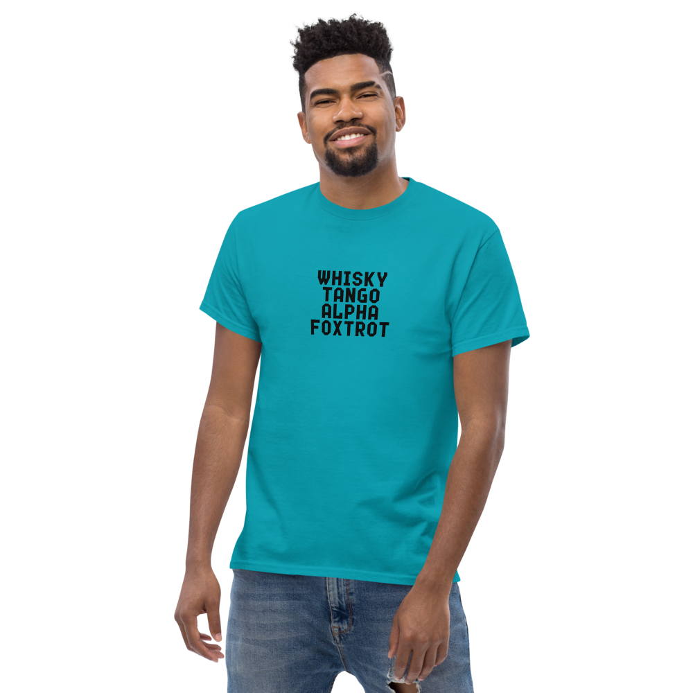 "Whisky Tango Alpha Foxtrot" printed on a tropical blue unisex classic tee worn by a male