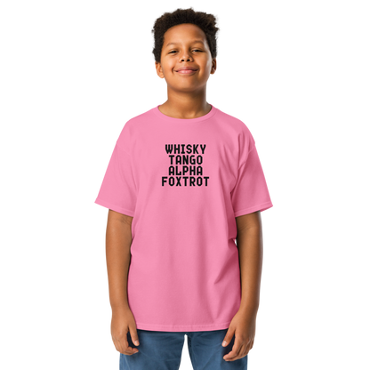 "Whisky Tango Alpha Foxtrot" printed on a azalea youth classic tee worn by a male