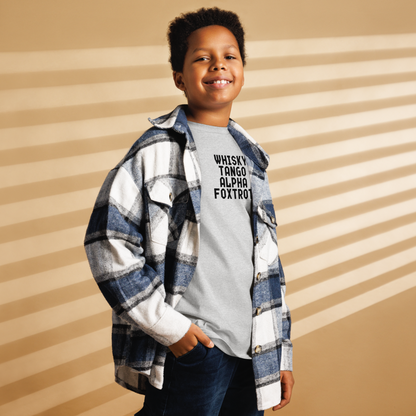 "Whisky Tango Alpha Foxtrot" printed on a sport grey youth classic tee worn by a male also wearing a jacket