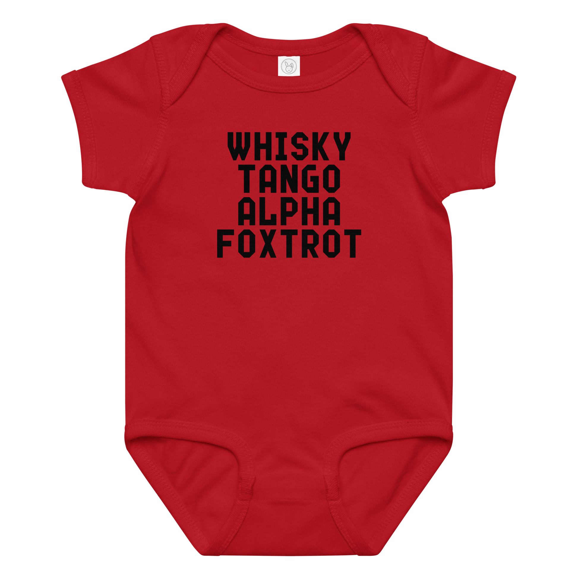 "Whisky Tango Alpha Foxtrot" printed on a red baby jersey bodysuit laying on a flat surface amongst other clothes