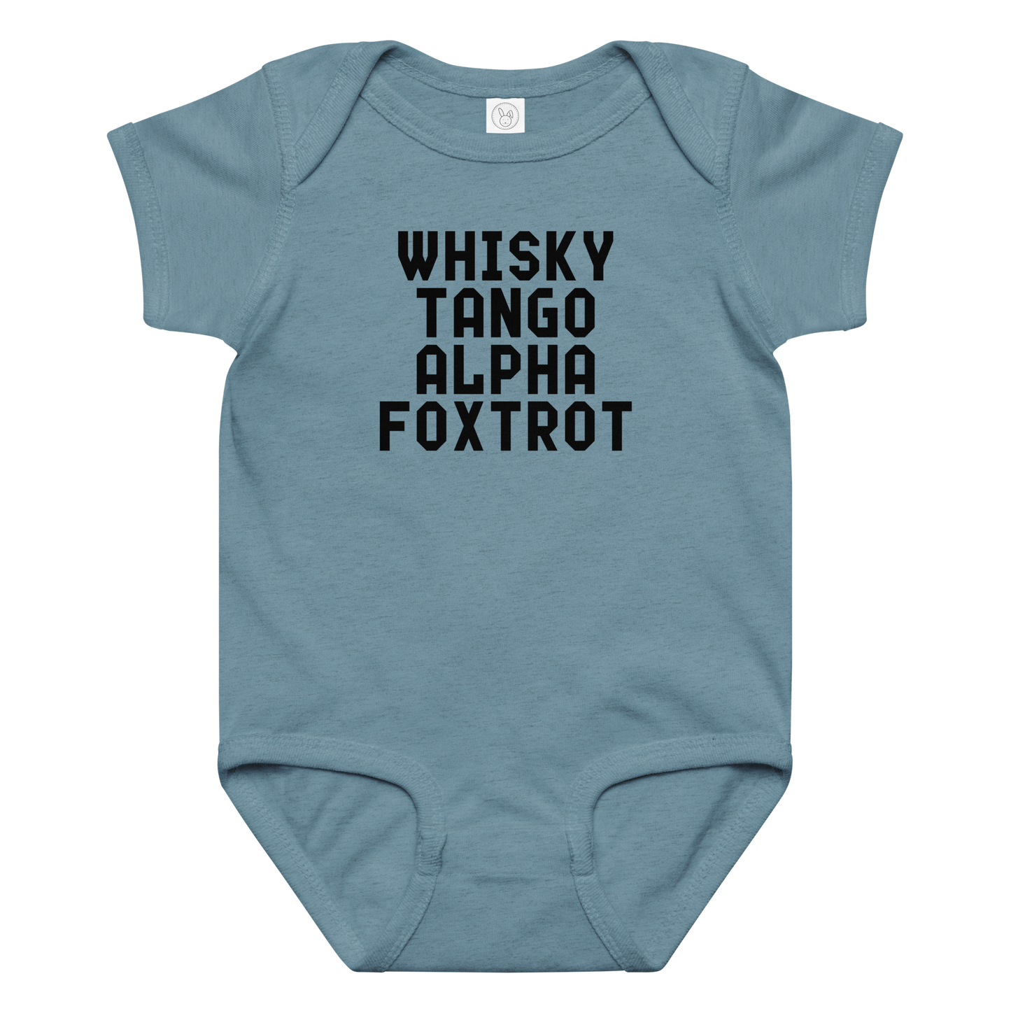 "Whisky Tango Alpha Foxtrot" printed on a vintage indigo baby jersey bodysuit laying on a flat surface amongst other clothes