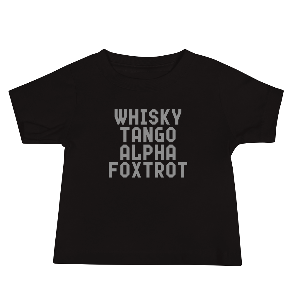 "Whisky Tango Alpha Foxtrot" printed on a black baby jersey short sleeve tee laying on a flat surface