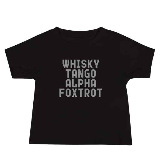 "Whisky Tango Alpha Foxtrot" printed on a black baby jersey short sleeve tee laying on a flat surface