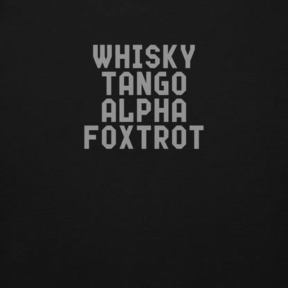 "Whisky Tango Alpha Foxtrot" printed on a black background