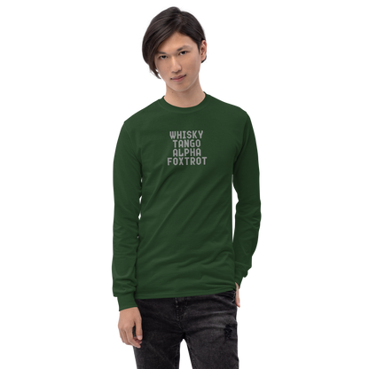 "Whisky Tango Alpha Foxtrot" printed on a forest green men's long sleeve shirt worn by a male