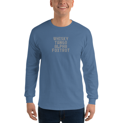 "Whisky Tango Alpha Foxtrot" printed on a indigo blue men's long sleeve shirt worn by a male