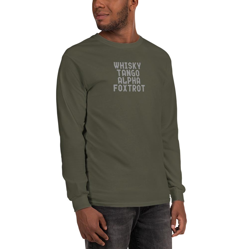 "Whisky Tango Alpha Foxtrot" printed on a military green men's long sleeve shirt worn by a male