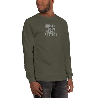 "Whisky Tango Alpha Foxtrot" printed on a military green men's long sleeve shirt worn by a male