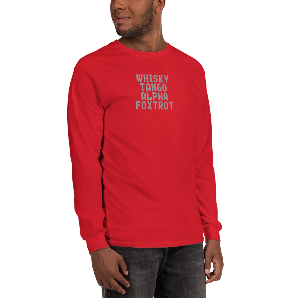 "Whisky Tango Alpha Foxtrot" printed on a red men's long sleeve shirt worn by a male