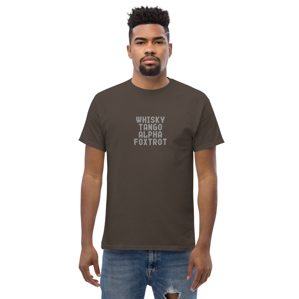 "Whisky Tango Alpha Foxtrot" printed on a dark chocolate unisex classic tee worn by a male