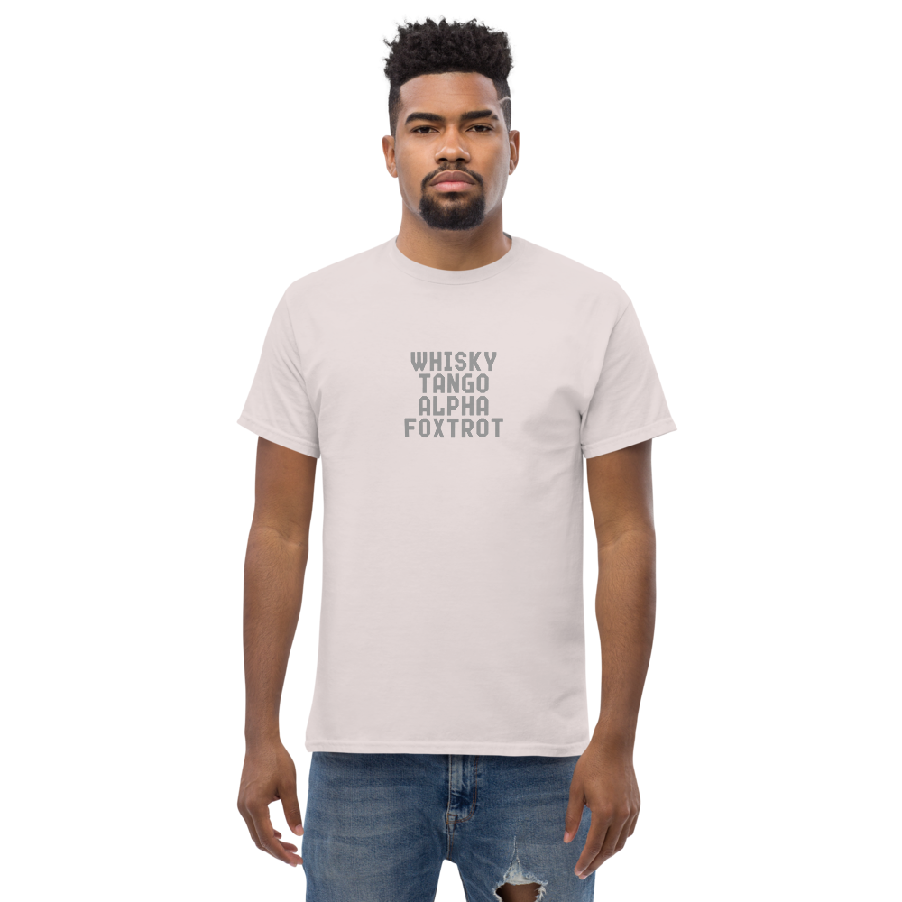 "Whisky Tango Alpha Foxtrot" printed on a ice grey unisex classic tee worn by a male