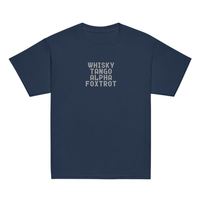 "Whisky Tango Alpha Foxtrot" printed on a navy youth classic tee laying on a flat surface