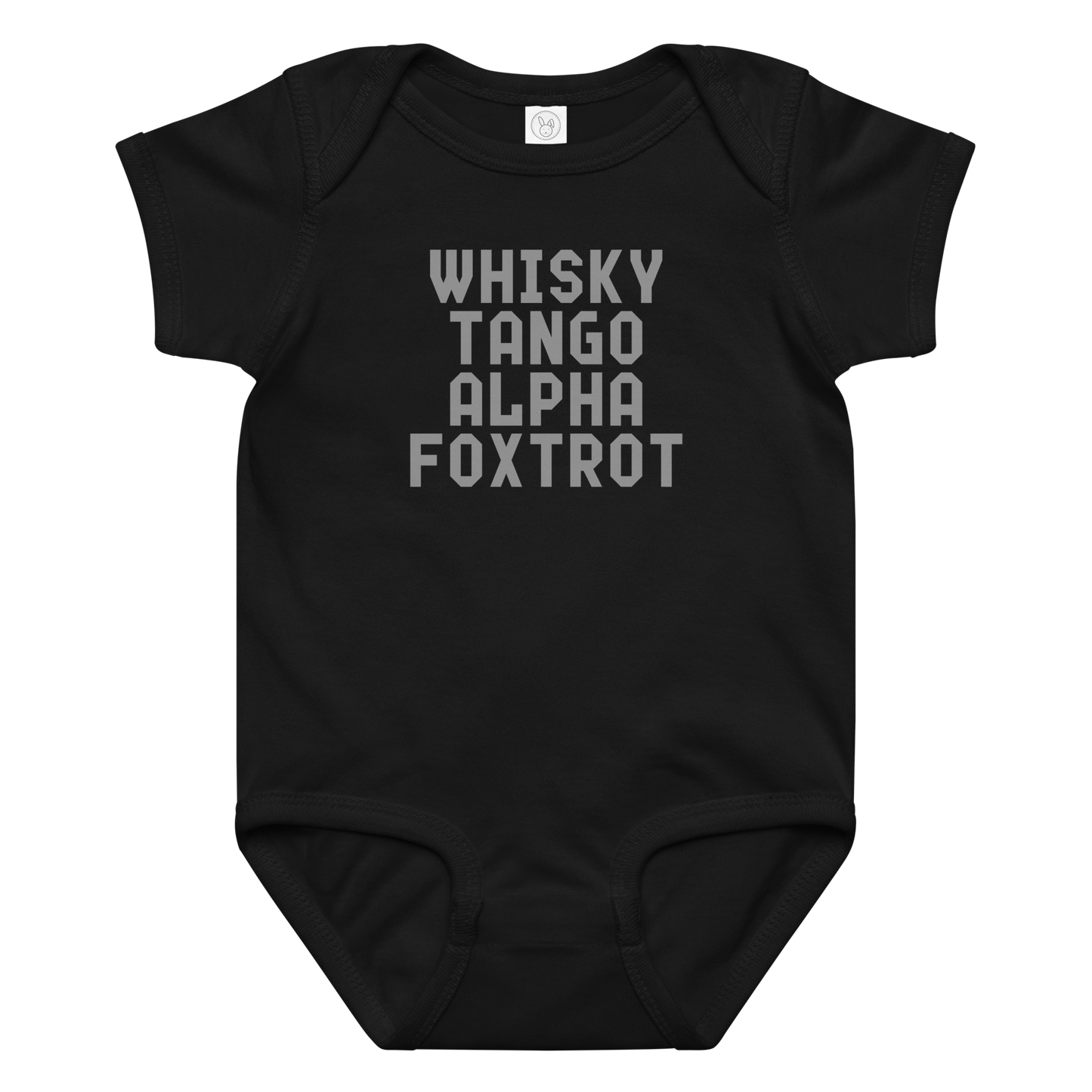 "Whisky Tango Alpha Foxtrot" printed on a black baby jersey bodysuit laying on a flat surface amongst other clothes