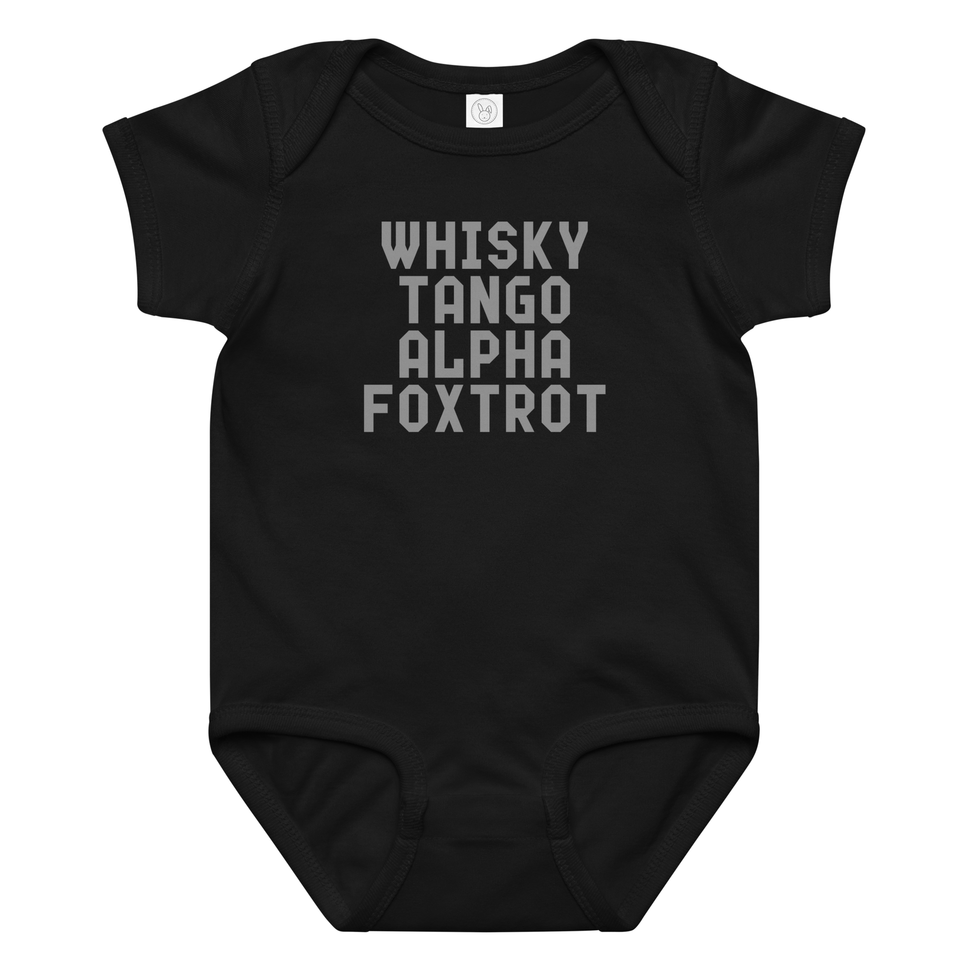 "Whisky Tango Alpha Foxtrot" printed on a black baby jersey bodysuit laying on a flat surface amongst other clothes