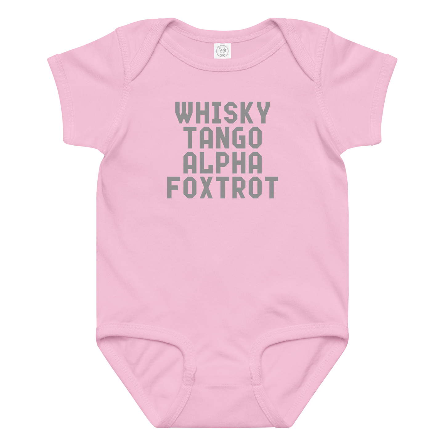 "Whisky Tango Alpha Foxtrot" printed on a pink baby jersey bodysuit laying on a flat surface amongst other clothes