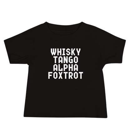 "Whisky Tango Alpha Foxtrot" printed on a black baby jersey short sleeve tee laying on a flat surface