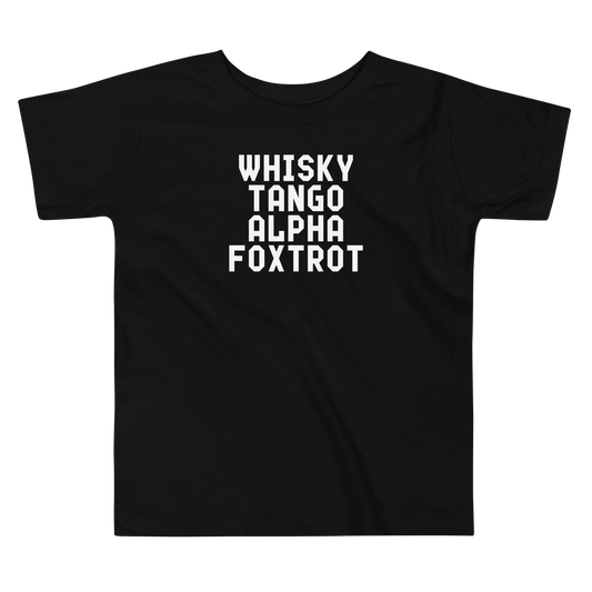 "Whisky Tango Alpha Foxtrot" printed on a black toddler short sleeve tee laying on a flat surface