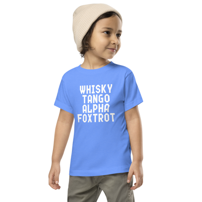 "Whisky Tango Alpha Foxtrot" printed on a heather columbia blue toddler short sleeve tee worn by a male wearing a cap
