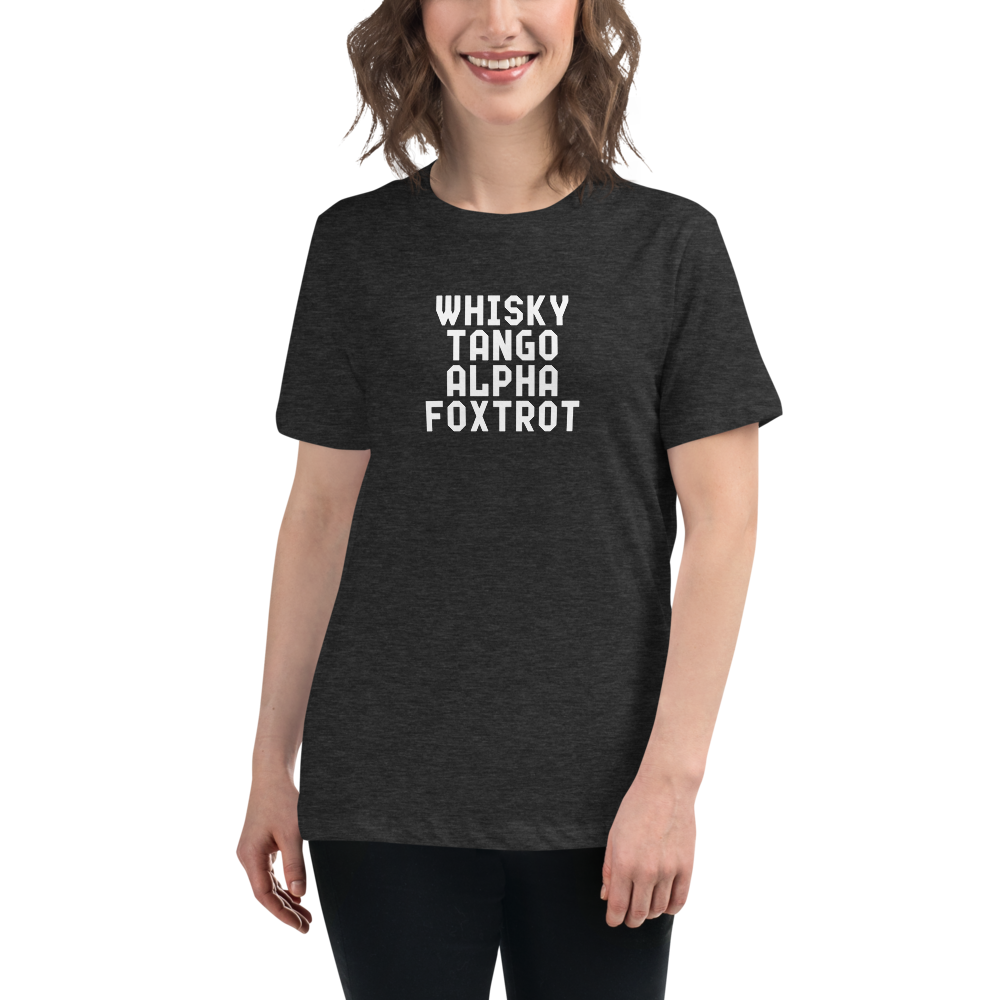 "Whisky Tango Alpha Foxtrot" printed on a dark grey heather women's relaxed t-shirt worn by a female
