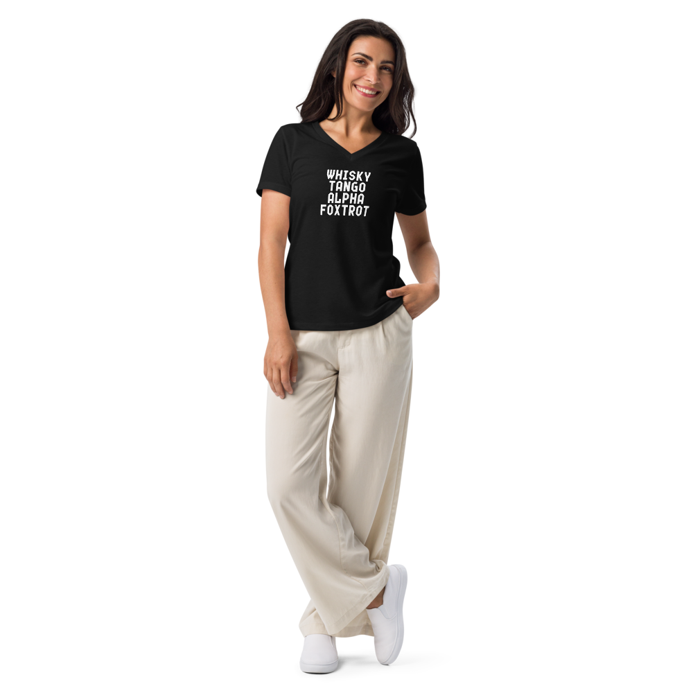 "Whisky Tango Alpha Foxtrot" printed on a solid black blend women's relaxed v-neck t-shirt worn by a female