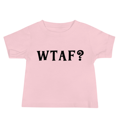 "WTAF?" printed on a pink baby jersey short sleeve tee laying on a flat surface