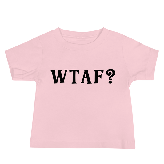 "WTAF?" printed on a pink baby jersey short sleeve tee laying on a flat surface