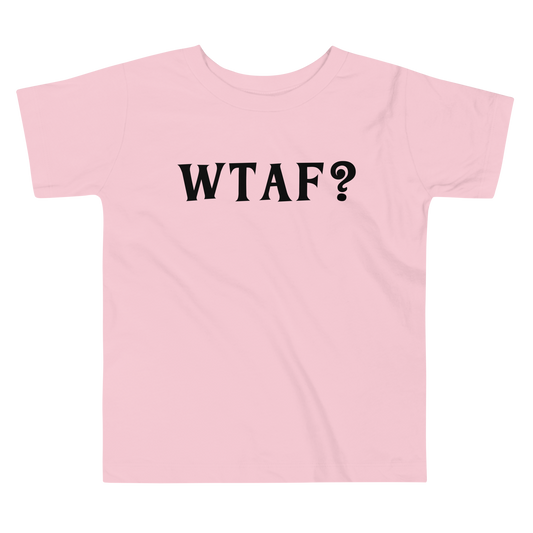 "WTAF?" printed on a pink toddler short sleeve tee laying on a flat surface