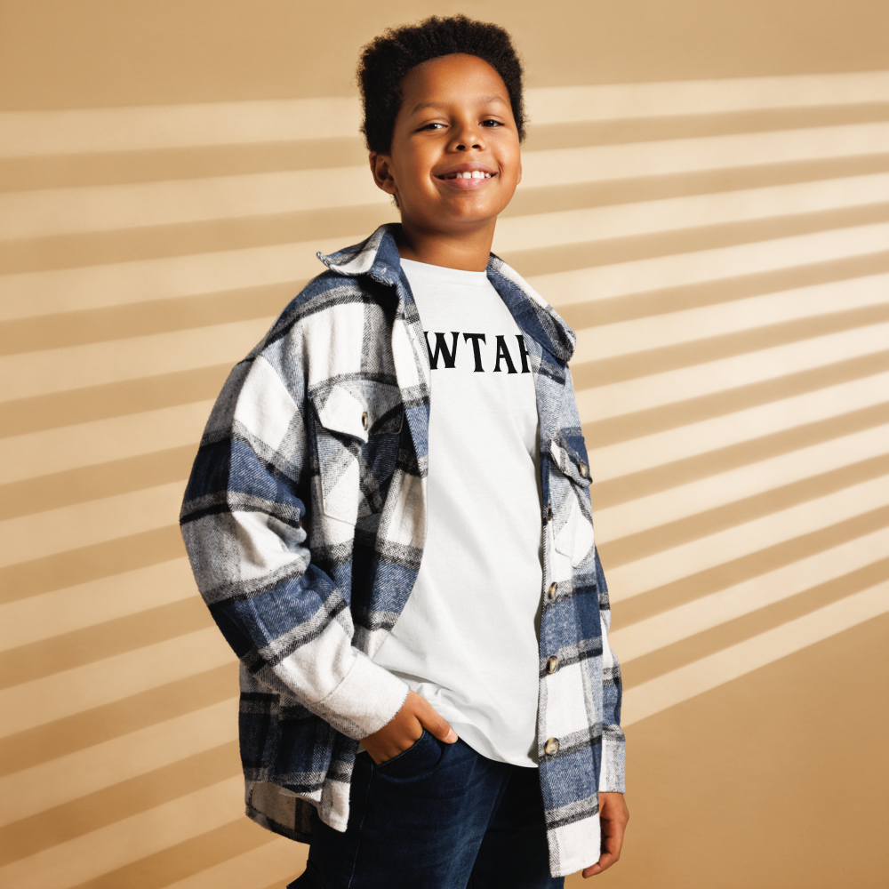 "WTAF?" printed on a white youth classic tee worn by a male also wearing a jacket