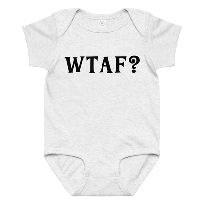 "WTAF?" printed on a ash baby jersey bodysuit laying on a flat surface amongst other clothes