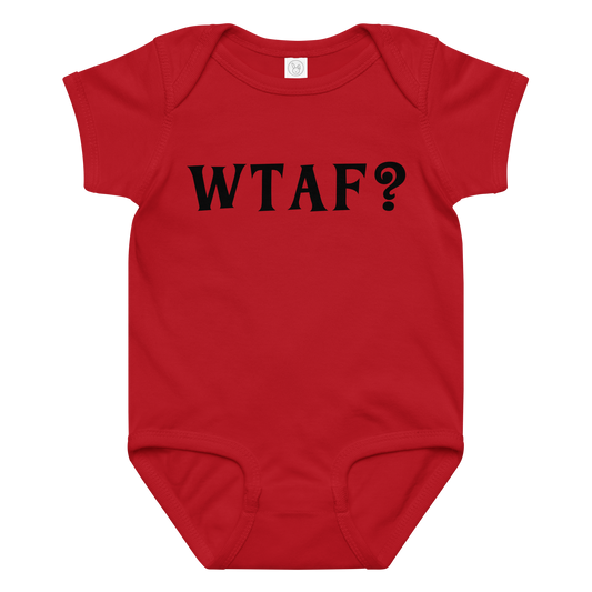 "WTAF?" printed on a red baby jersey bodysuit laying on a flat surface amongst other clothes