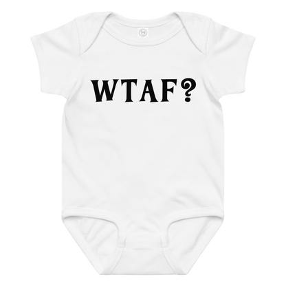 "WTAF?" printed on a white baby jersey bodysuit laying on a flat surface amongst other clothes
