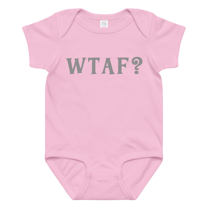 "WTAF?" printed on a pink baby jersey bodysuit laying on a flat surface amongst other clothes